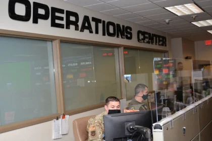 Operators monitoring screens inside an operations centre