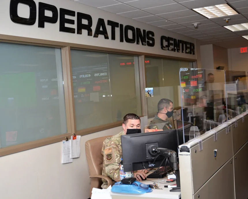 Operators monitoring screens inside an operations centre